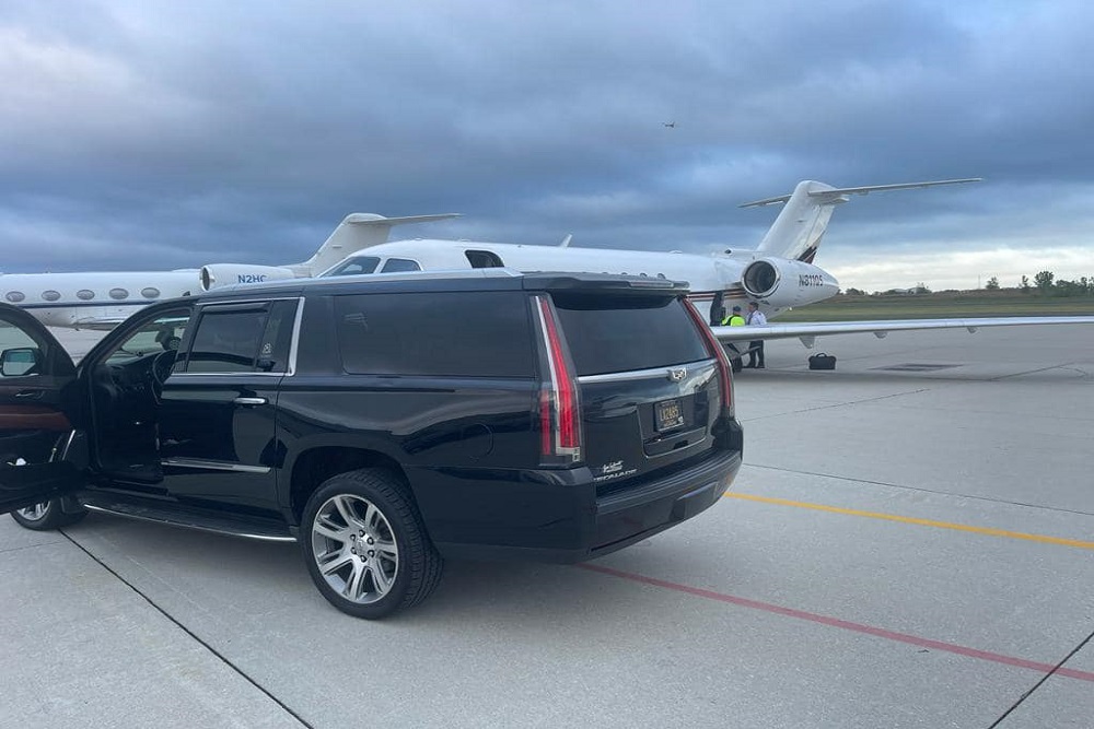 Royal Limousine Cadillac Escalade waiting planeside with the door open