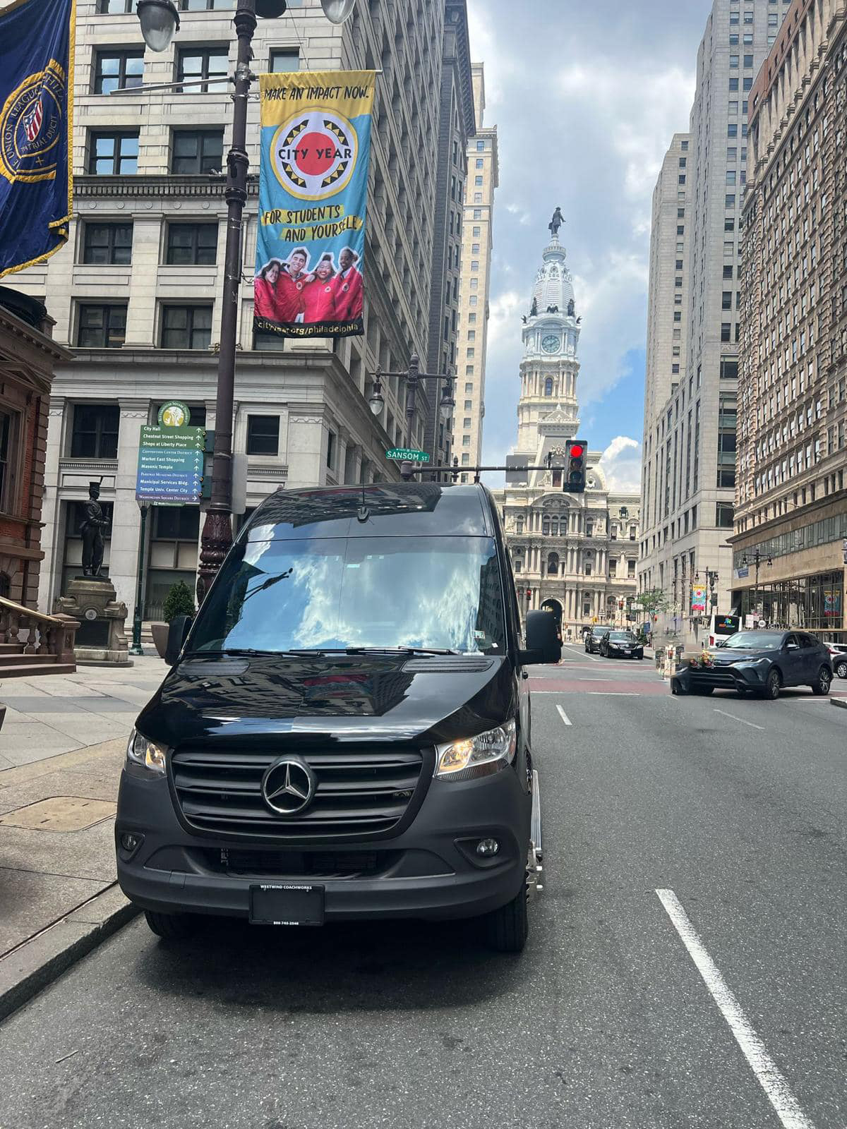 Royal Limousine Sprinter parked on Sansom Street with Philadelphia City Hall behind it